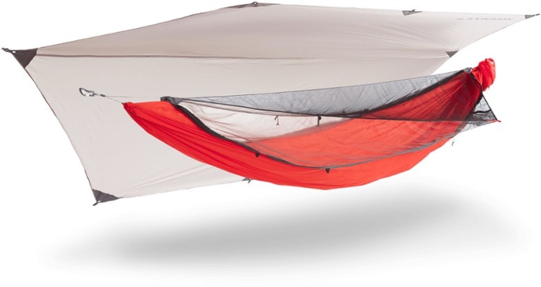 Kammok Mantis ultralight hammock tent set up in a lush forest, showcasing its mesh canopy and rainfly.