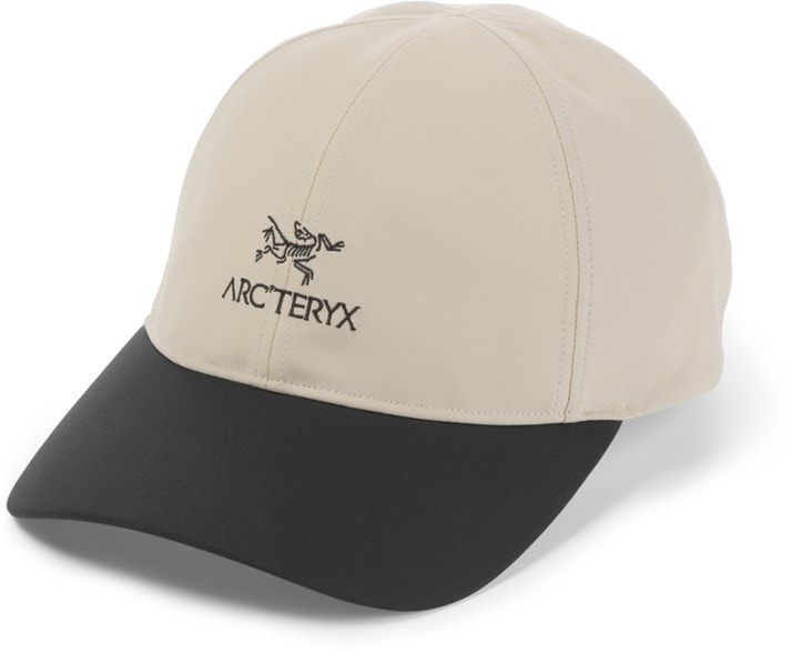 Arc'teryx Bird Word cap angled view, showcasing breathable material and adjustable buckle.