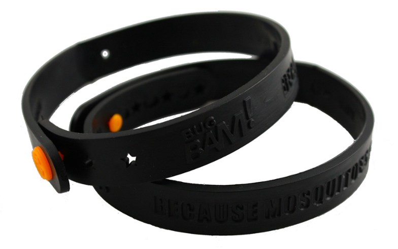 Eco-friendly mosquito repellent band worn on wrist during hiking.