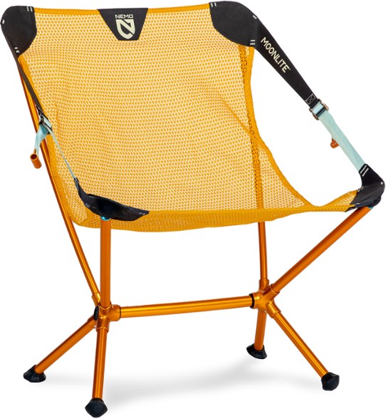 Moonlite reclining camp chair set up in a beautiful park during a picnic.