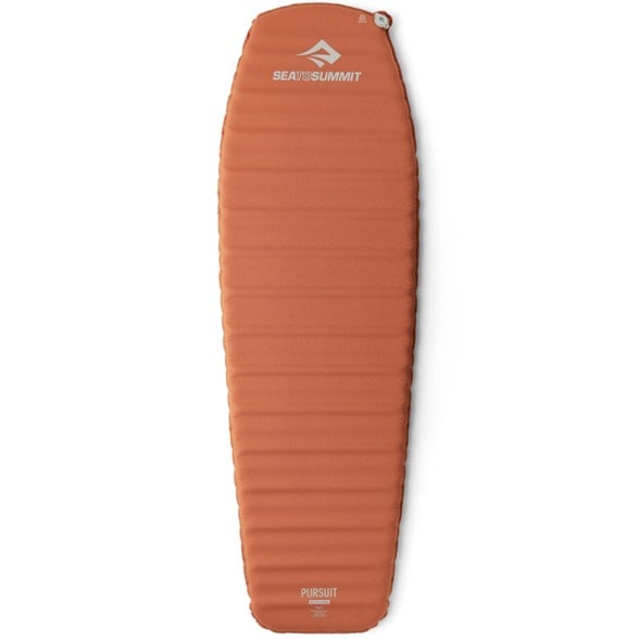 Side view of Pursuit UltraLite self-inflating sleeping pad fully inflated on rocky terrain, highlighting its foam-supported channel design