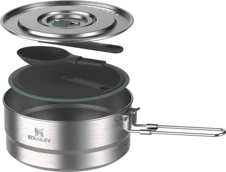 Top-down view of camping cookware set showing saucepan with vented lid and folding handle
