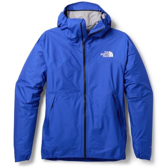 Men wearing the Summit Series FUTURELIGHT jacket while hiking on a mountain trail, showcasing its lightweight design.