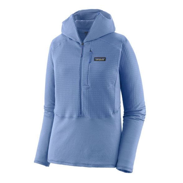 Patagonia Women's R1 Pullover Hoody in action during a hike, showcasing its flexibility and warmth.