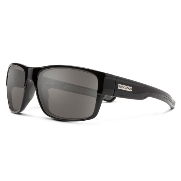 Suncloud Range polarized sunglasses on a fishing trip, showcasing the wraparound design.