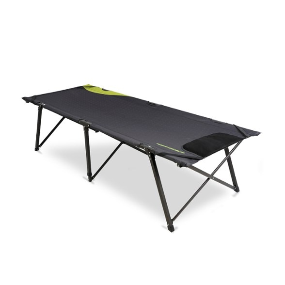 Zempire King Single Expedition Cot in a campsite with a scenic view, highlighting its spacious design.
