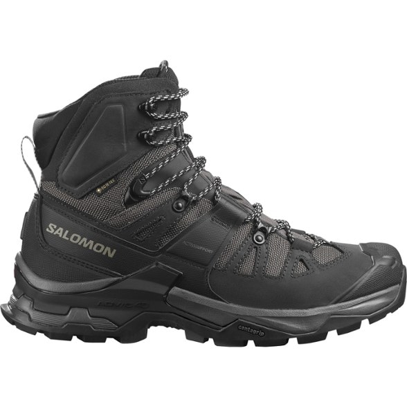Salomon Quest 4 GORE-TEX Backpacking Boots in action on a rocky trail.