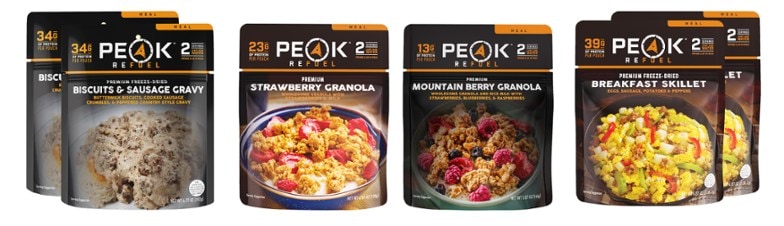 PEAK REFUEL meal kit with servings ready to cook in a camping setup.