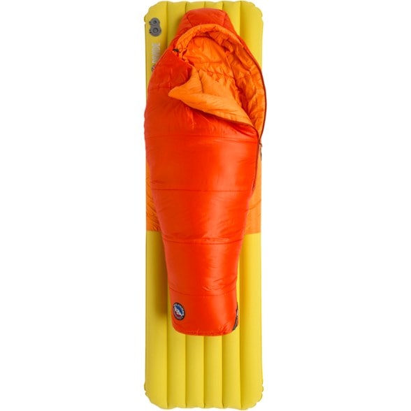 Big Agnes Kids' Adventure 20 sleeping bag in a tent during a camping trip, showcasing its vibrant color.