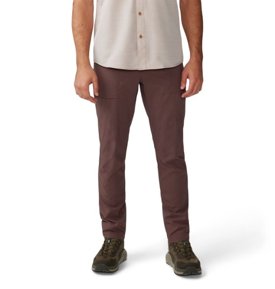 Front view of men's trail pants in outdoor setting, showcasing lightweight ripstop material and pocket placement