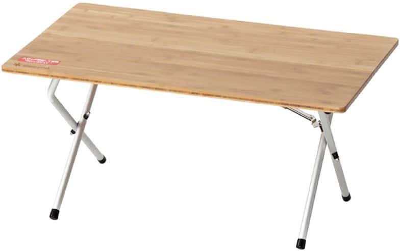 Snow Peak Voyager portable camping table with laminated bamboo surface set up outdoors