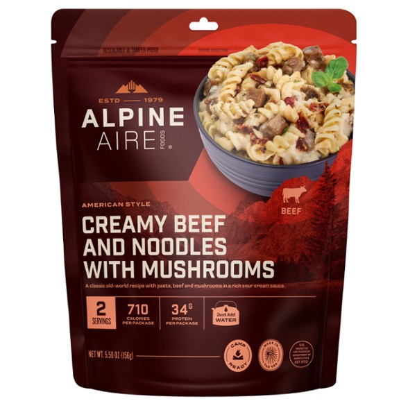 Savory beef and noodles meal cooked in the wild, highlighting its creamy sauce and hearty ingredients.