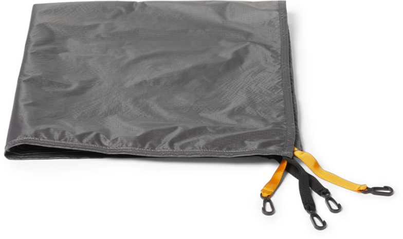 Top-down view of Flash Air 2 tent footprint laid out on rocky terrain, showcasing its durable waterproof material