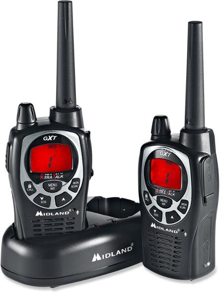 Midland GXT1000VP4 2-way GMRS radios showcasing their rugged design in a camping setting.