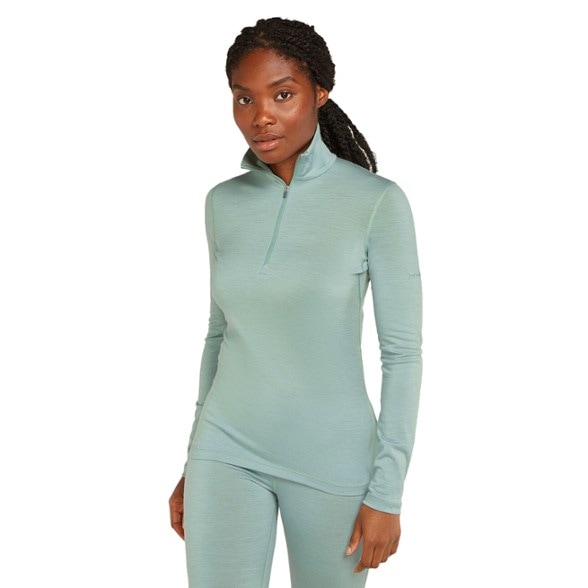 Front view of women's merino wool base layer featuring half zip pullover for hiking