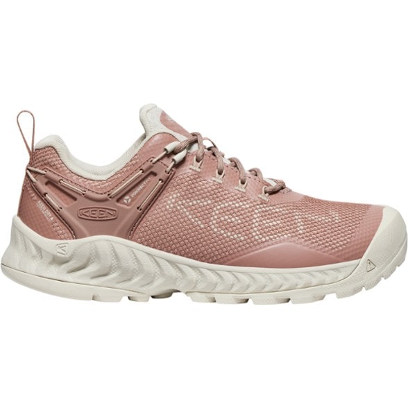 Side view of Keen NXIS EVO Women's Waterproof Hiking Shoes on a rocky trail.