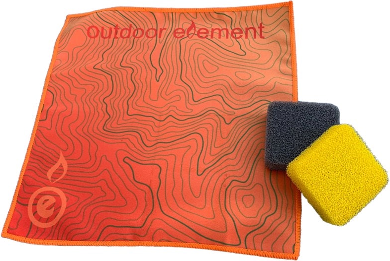 Eco-friendly camp cleaning set displayed with cookware
