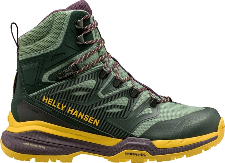 Side view of women's waterproof hiking boots with ankle support on rocky trail