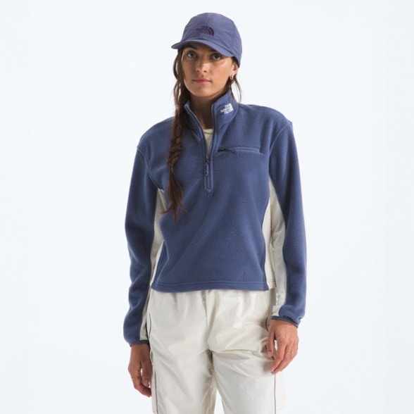 North Face Women's Half-Zip Fleece Top in action on a hiking trail.