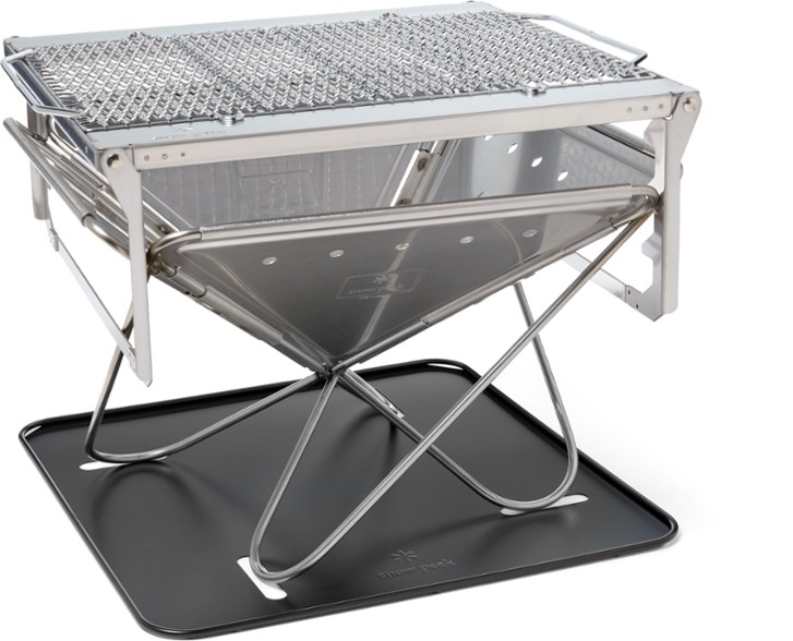 Takibi Portable Campfire Grill showing multiple grilling positions