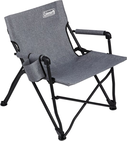 Side view of the Forester Series Premium Outdoor Chair set up in a sunny backyard with a drink in the cup holder.