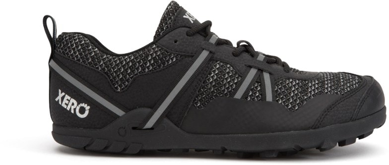 Xero TerraFlex II women's hiking shoes on a forest trail, highlighting their lightweight construction.