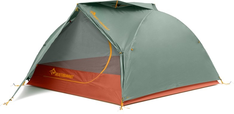 Ikos TR3 lightweight backpacking tent pitched on a forest trail showing spacious interior and dual doors