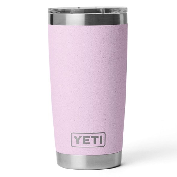 Side view of the stainless steel tumbler placed in a cupholder during a road trip
