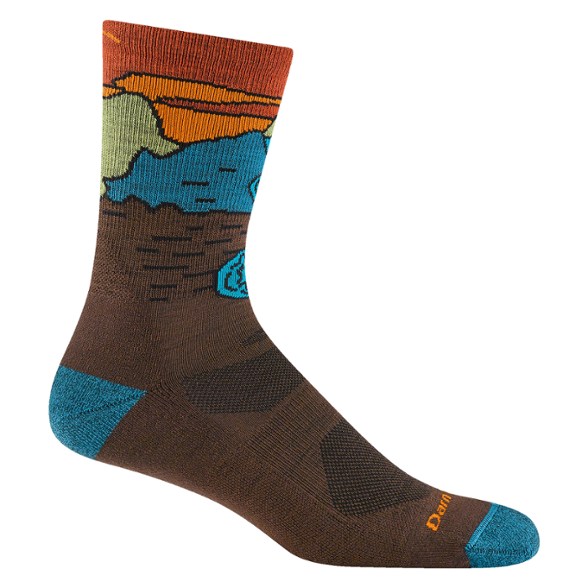 Chasing Waterfalls Merino Wool Crew Socks displayed on a rocky trail