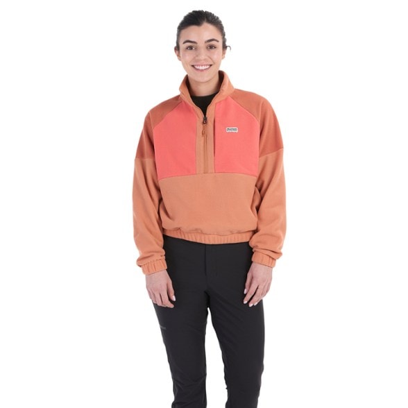Front view of women's fleece pullover in mint green with half-zip closure and secure chest pocket