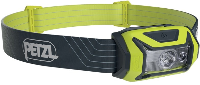 Petzl Tikka headlamp worn during night hiking, highlighting its adjustable beam.