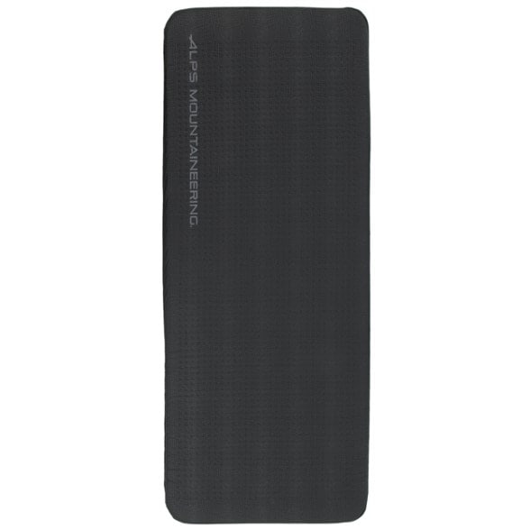 Luxury self-inflating camping mattress laid out in a forest setting, showcasing its thickness and comfort.