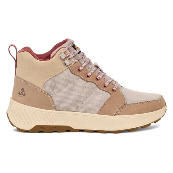 Teva Ellwood Mid hiking boots for women viewed from the side on a hiking trail.