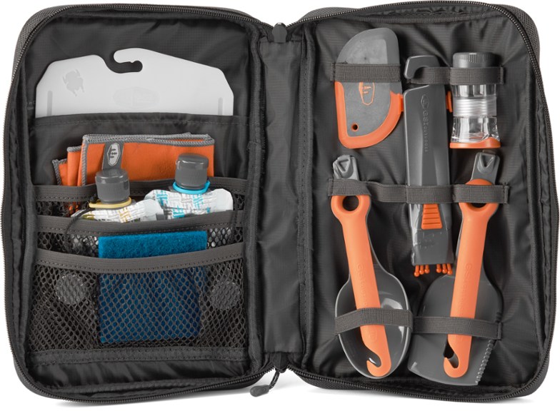Gourmet camping kitchen set displayed with utensils and case