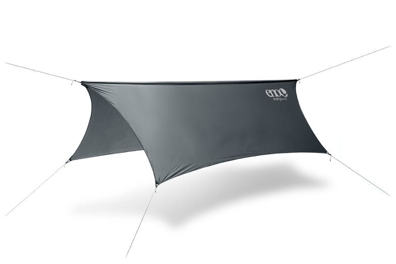 ProFly rain tarp set up over a hammock in a forest setting.