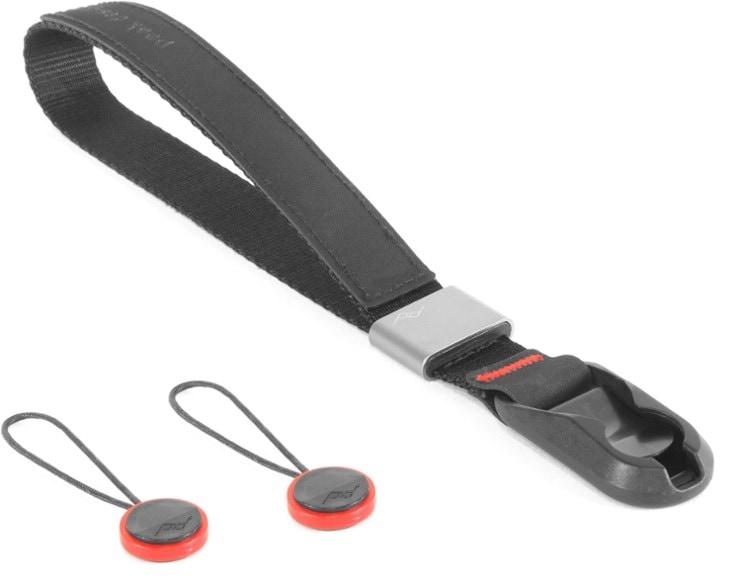 Close-up of the Peak Design Cuff camera safety strap, highlighting the nylon webbing and aluminum hardware.