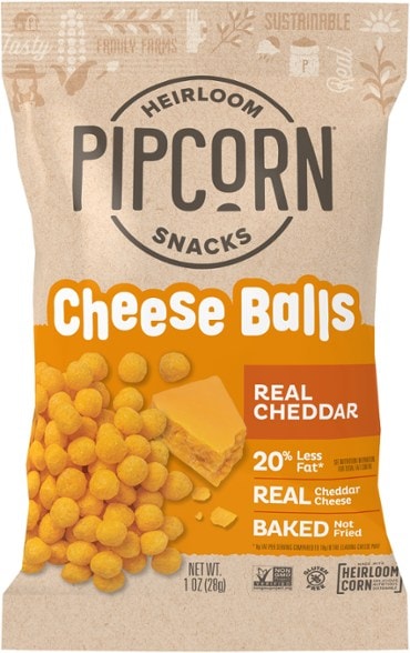 Close-up of Pipcorn's gluten-free cheese balls in a bowl, showcasing their crunchy texture.