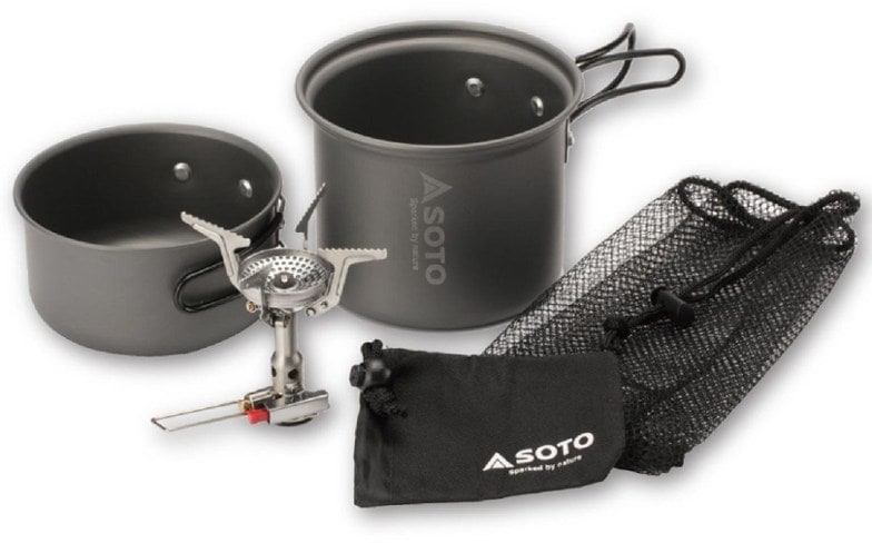 Amicus camping stove with pots set up for cooking in the wild.