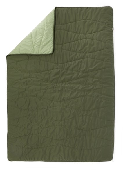 EcoTrail Comforter laid out in a campsite, highlighting its soft polyester shell.