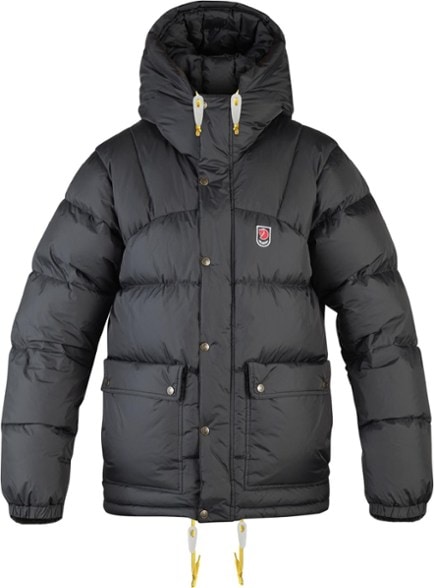 Men's Lightweight Expedition Down Jacket worn in the mountains, highlighting wind resistance and stylish comfort.