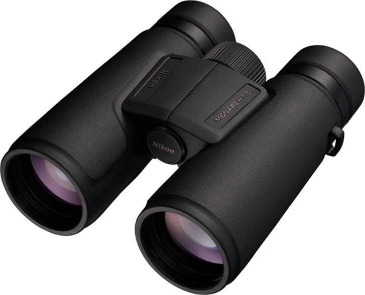 Nikon Monarch M5 8x42 binoculars on a hiking trail, showcasing their compact design.