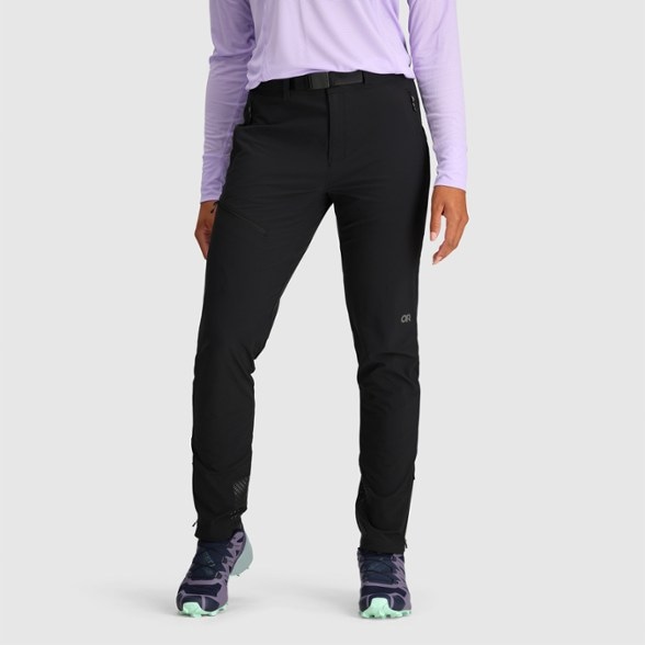 Alpine Breeze women's lightweight outdoor pants in action on a mountain trail.