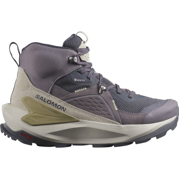 Side view of Elixir Women's GORE-TEX Hiking Boots on rocky terrain, highlighting their rugged design.