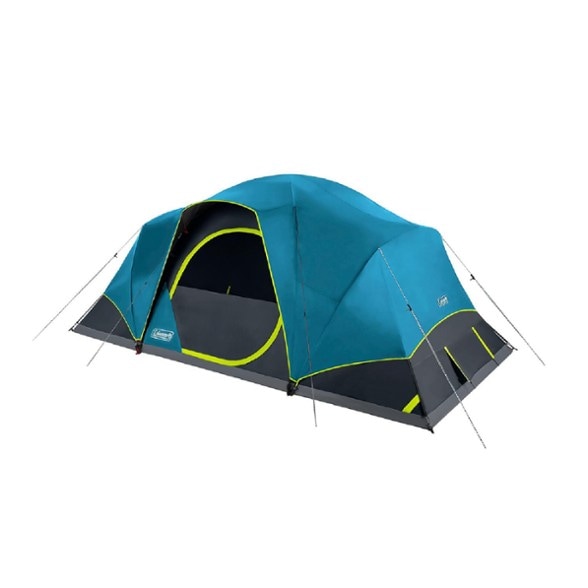 Coleman Skydome XL tent setup in a scenic camping area with a family enjoying inside.