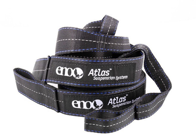 Close-up of ENO Atlas Pro hammock straps wrapped securely around a large tree in a forest setting