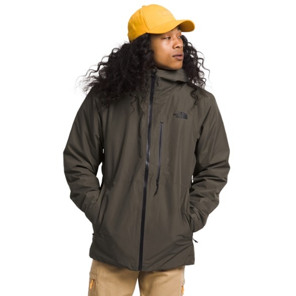 North Face Triclimate 3-in-1 Men's Jacket showcasing waterproof features in a snowy environment.