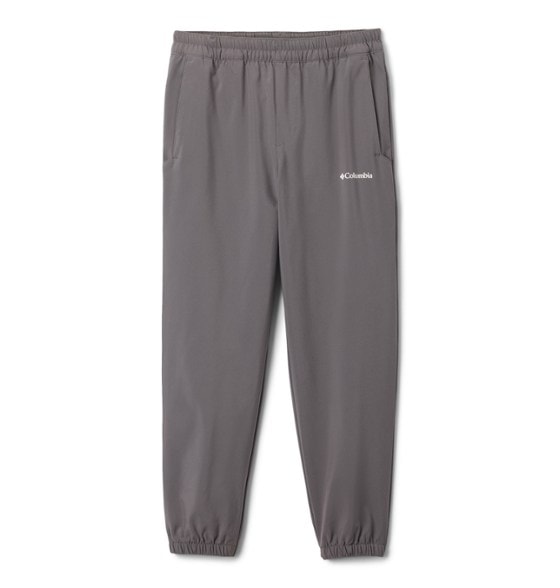 Columbia Kids' Trailblazer Jogger Pants in action on a hiking trail, showcasing sun protection features.