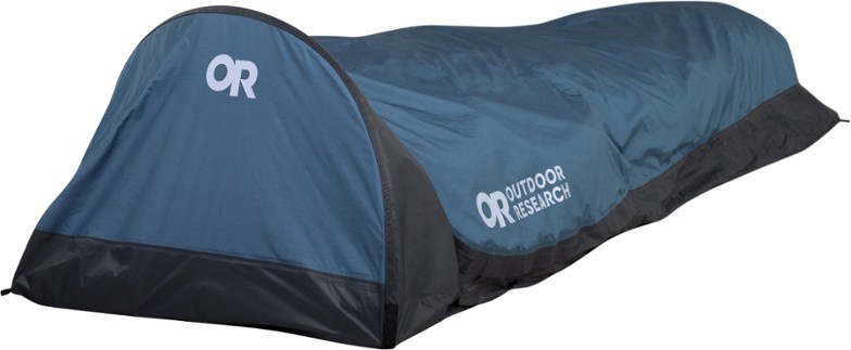 Close-up of the Alpine AscentShell bivy sack in a rugged alpine setting, highlighting its breathable fabric.