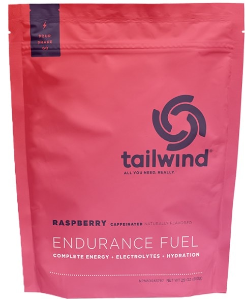 Close-up of Tailwind Caffeinated Endurance Mix showing packaging and serving suggestion.
