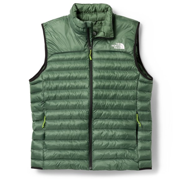 Men's ThermoBall insulated vest shown in action during a hiking trip, showcasing its lightweight and durable features.